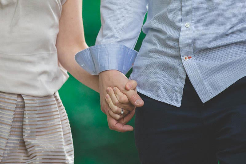 the photographer zoomed on the couple's hands