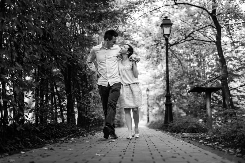 couple staring at each other in the eyes while walking on a footpath