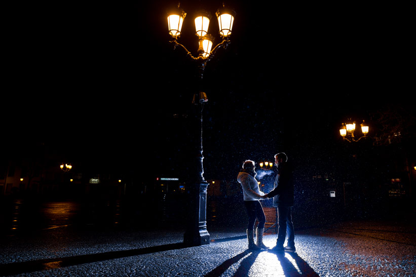 bridal couple lit backward by external flash of the photographer