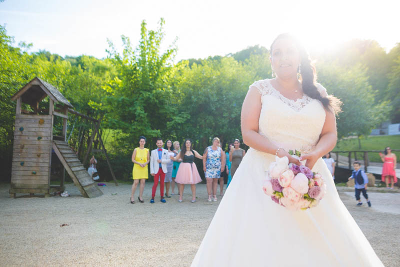 bride about to toss the bouqet at sunset