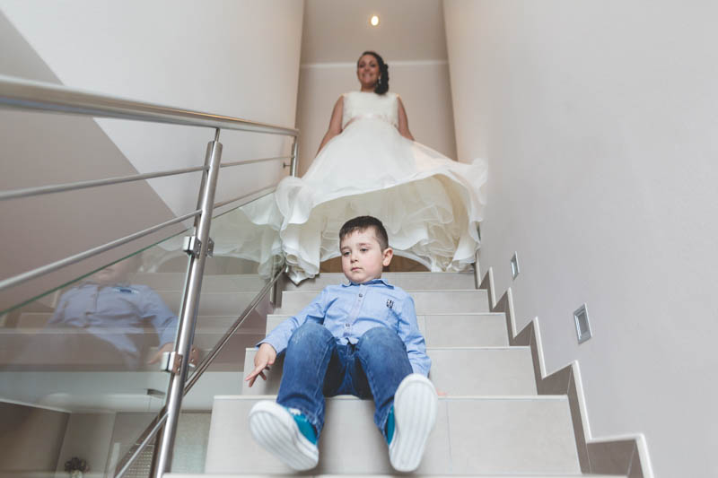 bride coming down the stairs at her place