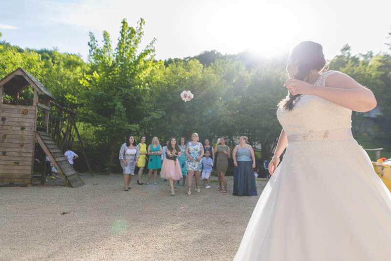 bride tossing the bouquet