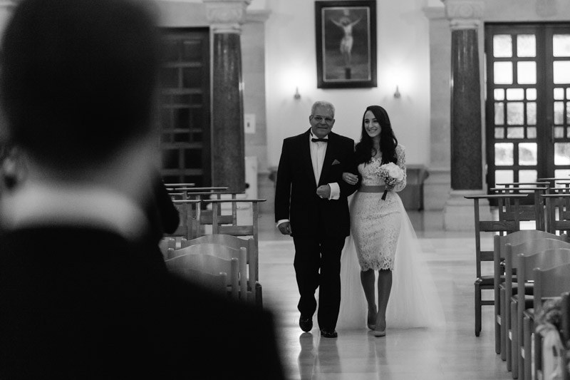 bride walking down the alley with her father