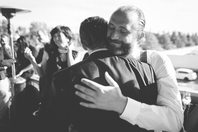groom congratulated by his friend
