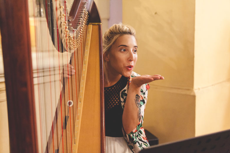 girl sends kiss after playing beautiful tune on harp