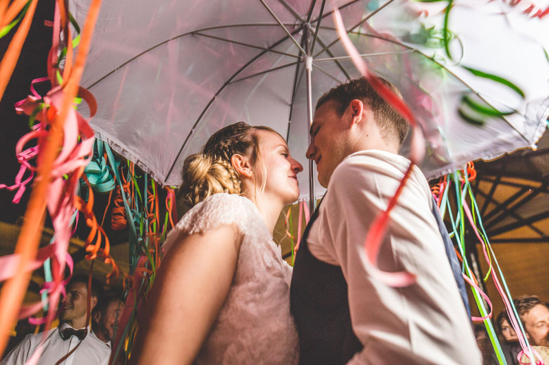 dancing under a white umbrella