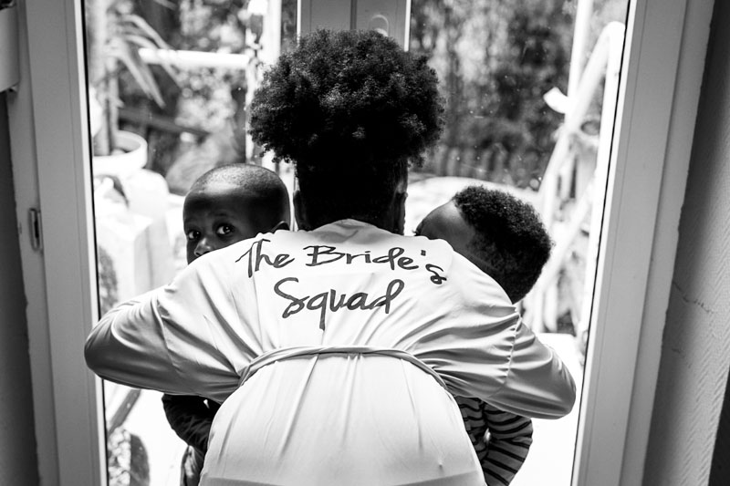 bride squad hugs children