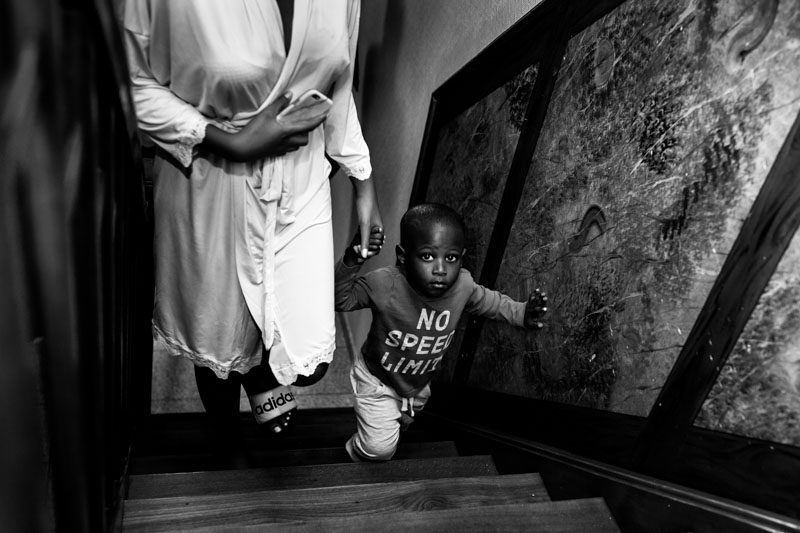 little boy climbs up stairs