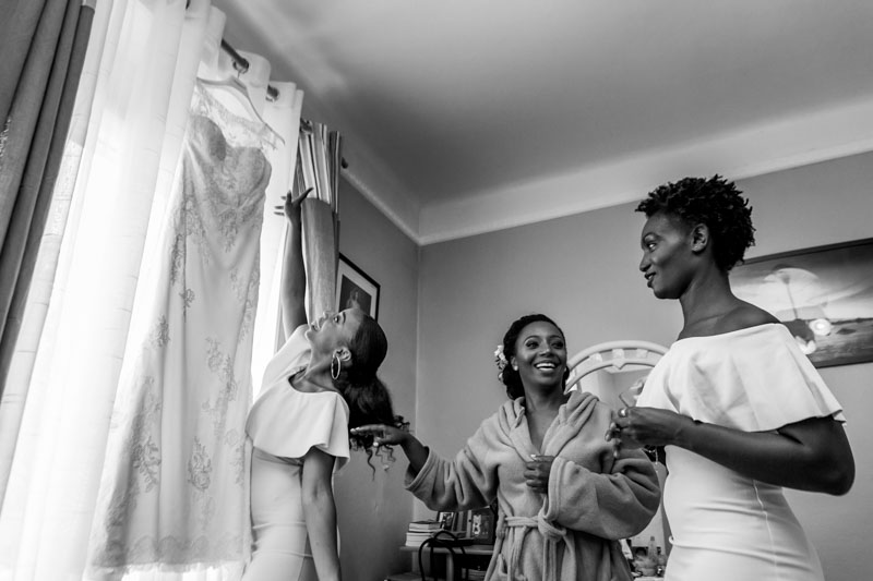 trying to reach the wedding dress but it's too high